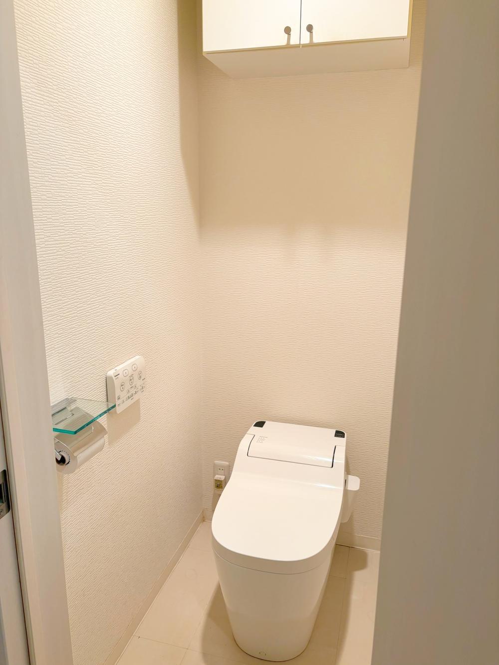 Separate toilet room with a modern washlet.